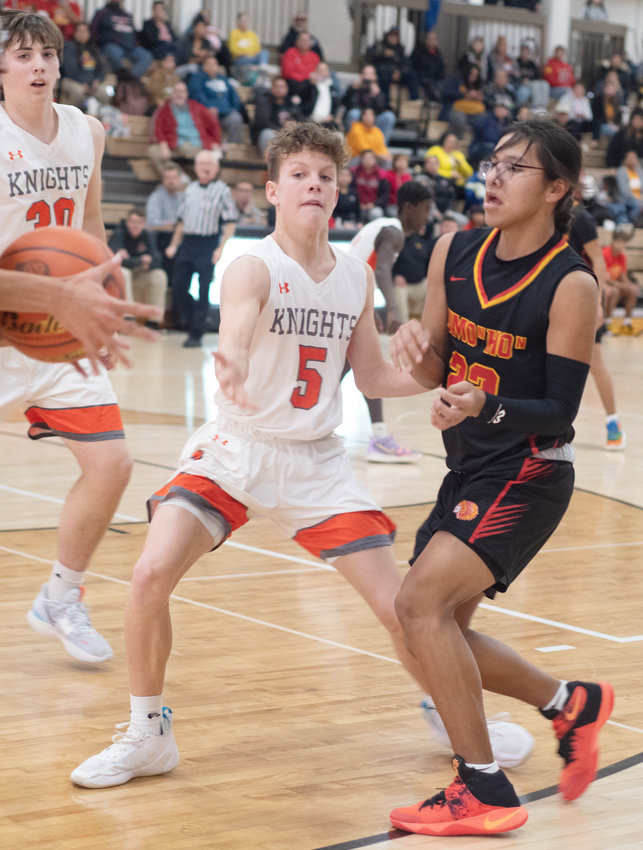 Isaak Maxwell seeks to interrupt a pass between the Omaha Nation players.