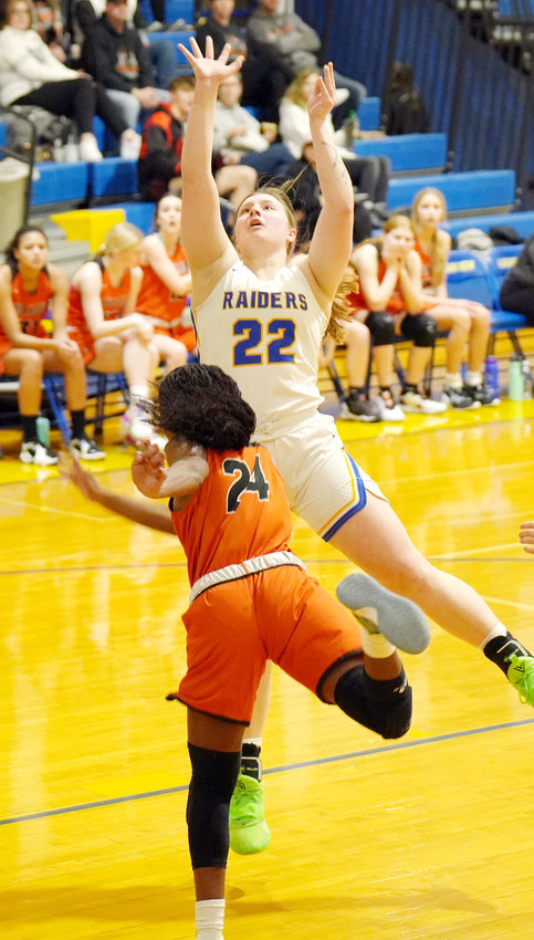 Senior Raider Sophia Vacha #22 connects on the jump shot in the lane against Ft. Calhoun.  Sophia had 3 points and 3 rebounds in the win over the Pioneers.