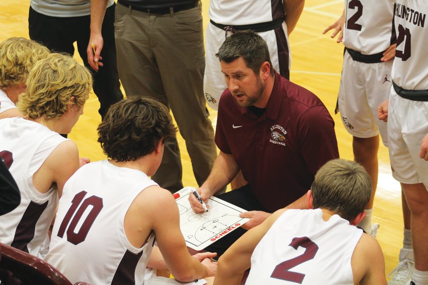 Arlington coach Tyler Spitser speaks with his team during a timeout in the Eagles' 52-41 loss to Syracuse on Thursday night.