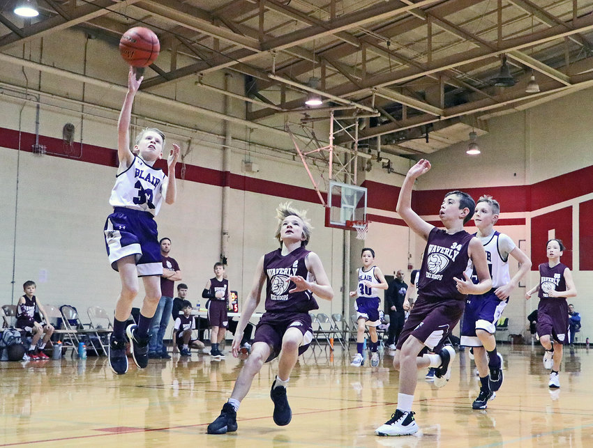 Owen Swaney of Blair Basketball Club's fifth-grade Purple squad shoots a layup Saturday at Gardner-Hawks Center. The Club hosted its annual Hoopstock Classic tournament Saturday and Sunday inside the former Dana College gymnasium. The girls' tournament begins this Saturday.