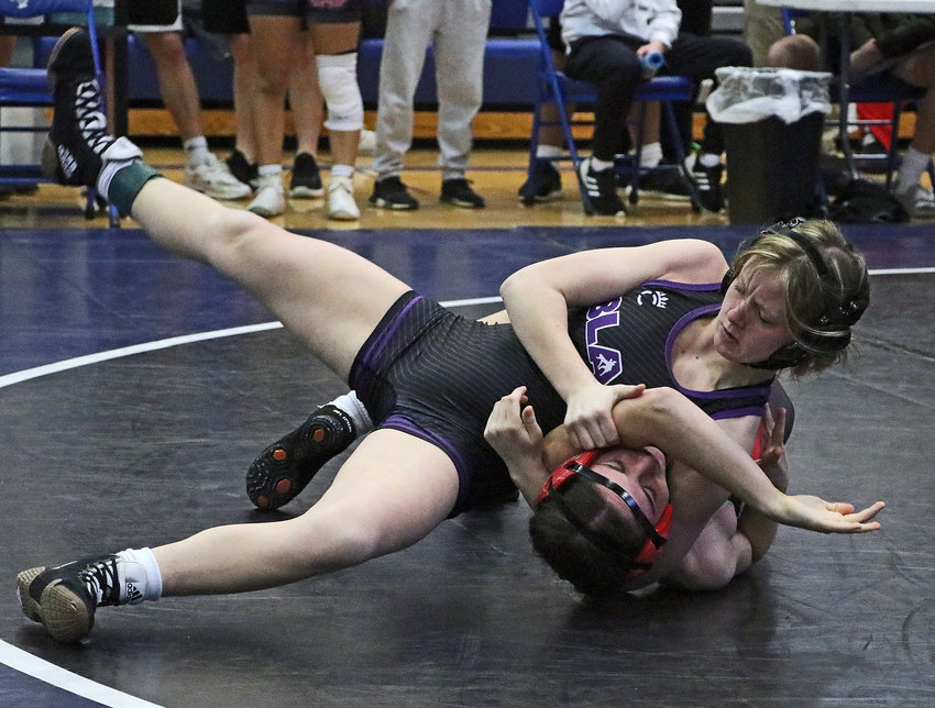 Blair 115-pounder Alison Wheeler, top, pins Elkhorn's Sydney Ferzely on Saturday during the Eastern Midlands Conference Tournament at Bennington High School.