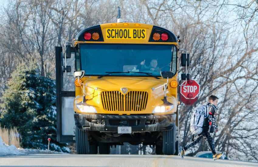 Blair bus driver gives the student a thumb&rsquo;s up signaling it is safe to cross to his home along P 35 after school on Thursday.