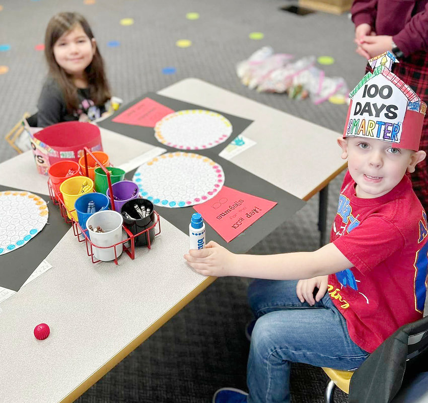 (left to right) Hanna Clark and Grayson Rief are about to see what 100 gumballs look like on their 100th day of school.