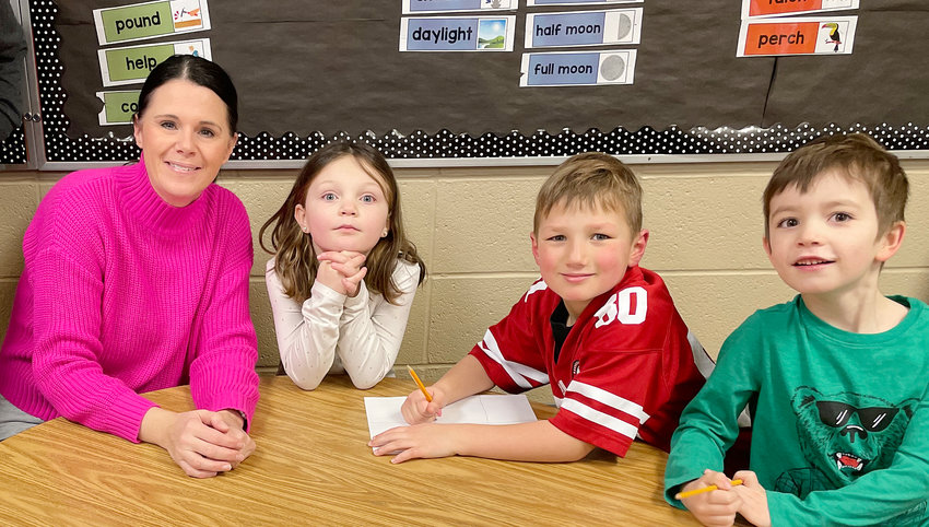 Now in her 11th year, Oakland-Craig first grade teacher Mrs. Kristin Johnson took a break from teaching earlier in her career to raise a family.  She returned after a 10-year hiatus.  Mrs. Johnson is pictured with some of her students &ndash; (from left) Sawyer Petersen, Tobias Sperling and Garrison Gramke.