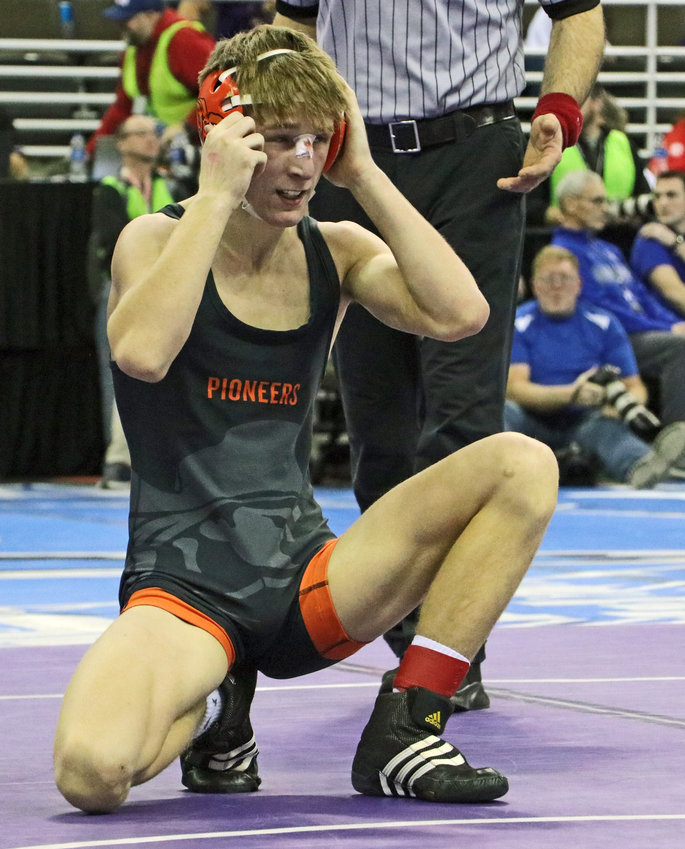 Fort Calhoun's Ely Olberding adjust his headgear during the 2023 state tournament. On Saturday, the 2023 FCHS grad earned college All-American status in Council Bluffs.