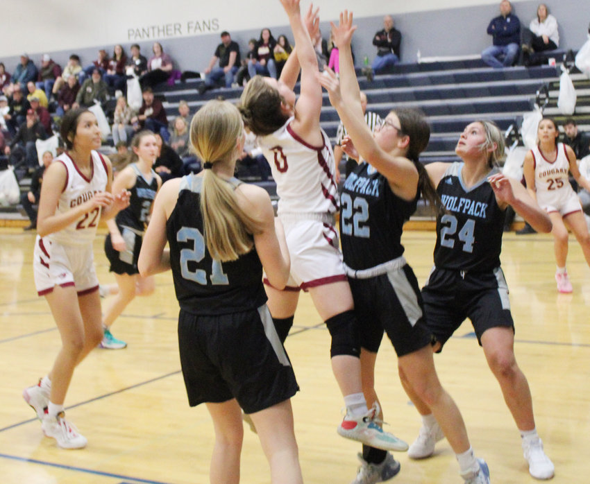 Camryn Brehmer in heavy traffic for a contested shot.