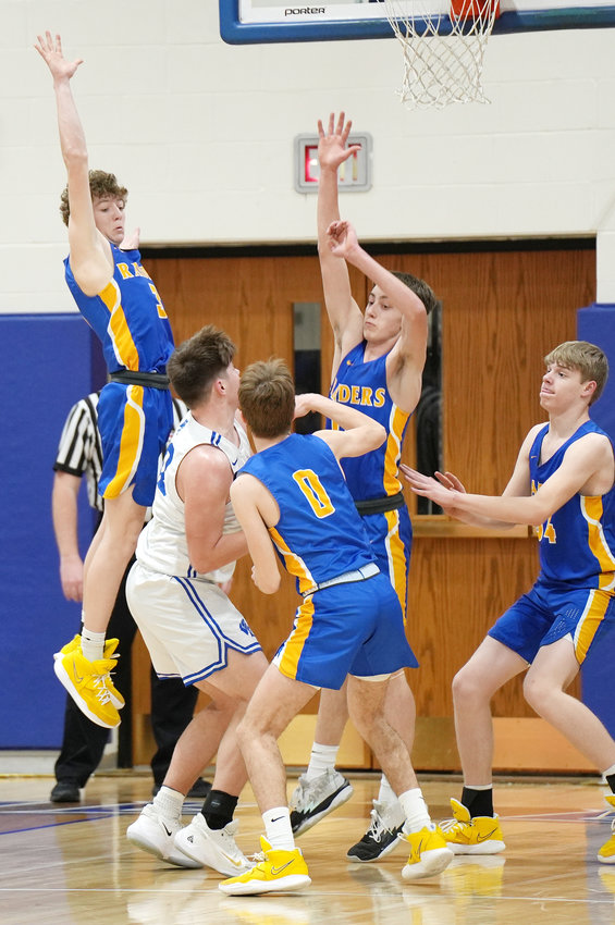 Nolan Robley #3, Josh Egbers #0, Kolton Kriete #11 and Cooper Kahlandt #34 put up the iron curtain on defense and shut down Wayne&rsquo;s attempt to drive to the hoop early in the first quarter