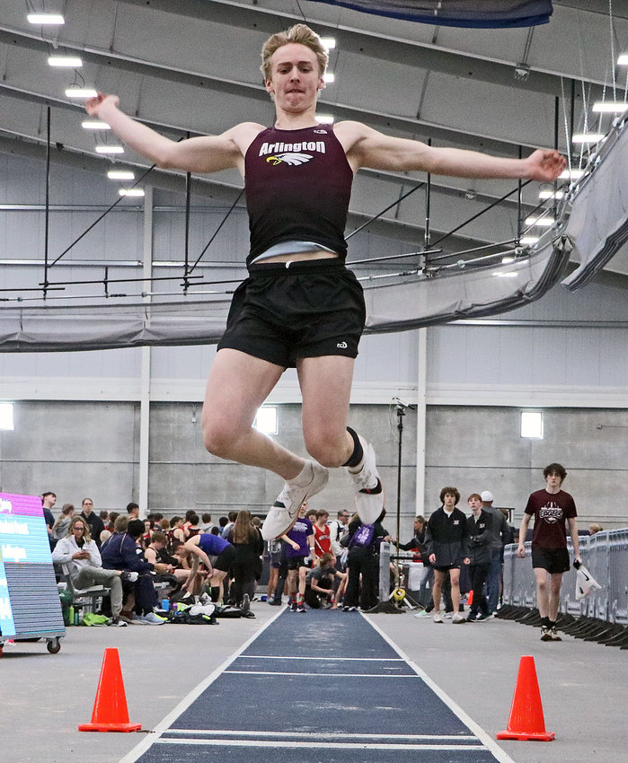 Arlington Eagle Kaden Foust competes in the long jump Friday during the Bulldog Challenge at Concordia University in Seward.