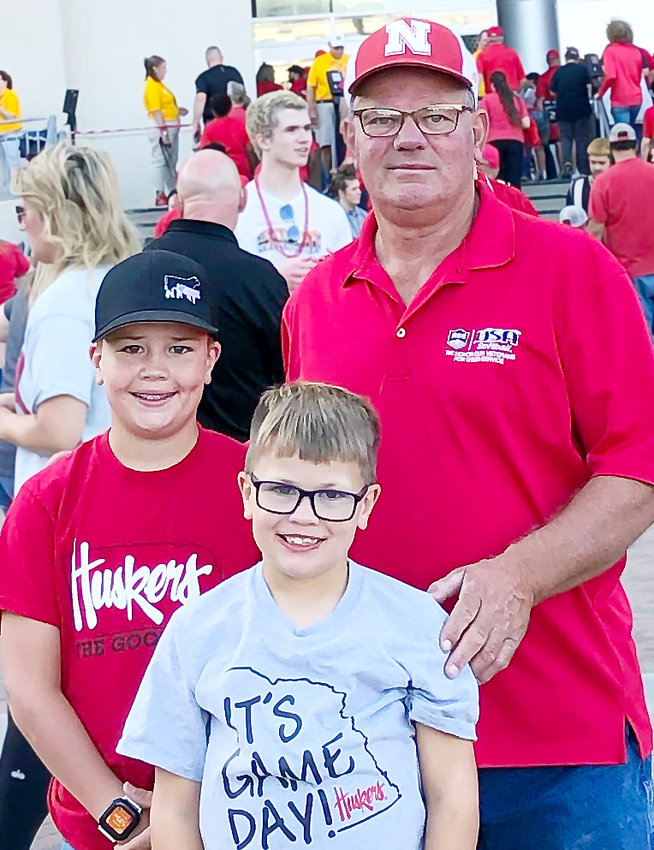 Jim Spath of North Bend enjoys a Nebraska Football Game with his grandsons Carsyn and Trent Miller, sons of Stuart and Leah Miller of Lyons.