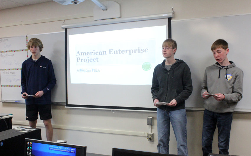 From left, Trent Koger, Joe Burns and Gus Burns practice their presentation on American Enterprise Project for the upcoming FBLA SLC in Kearney.