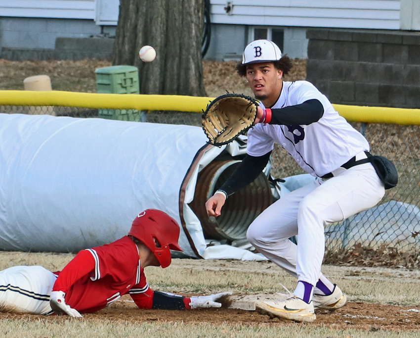 Blair junior J'Shawn Unger, right, stares down a pickoff attempt to first base Friday at Vets Field.