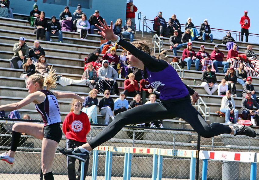Blair Bear Emma Ammon clears a hurdle Saturday during the Gary Dubbs Relays at Ralston High School.