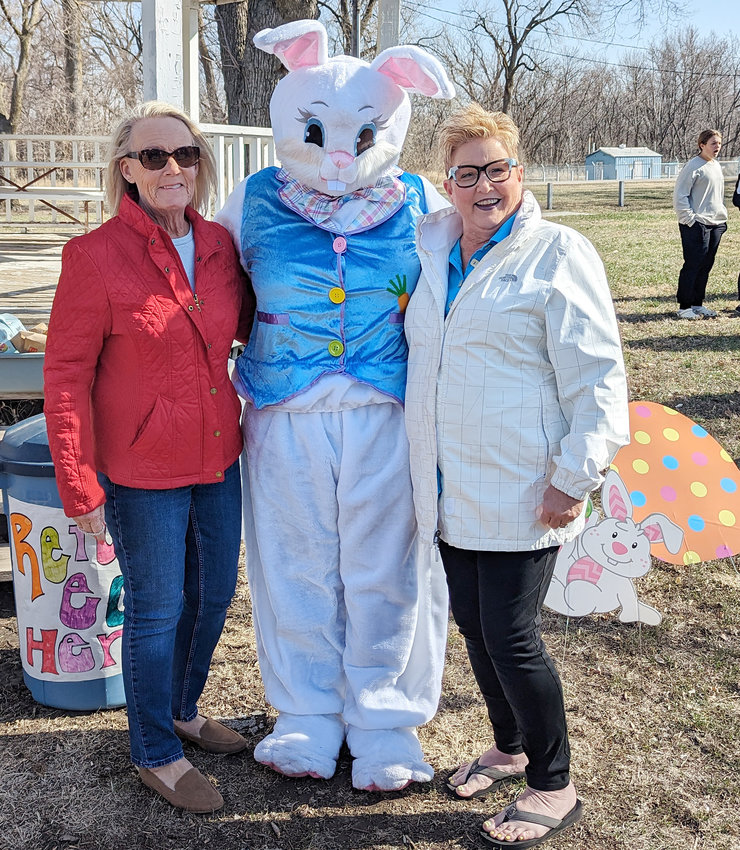 (left to right) Gloria Myers and Jane Larson couldn't help but take a picture with the guest of honor. A special thank you goes out to them and (not pictured) Paula Miller for filling the eggs.