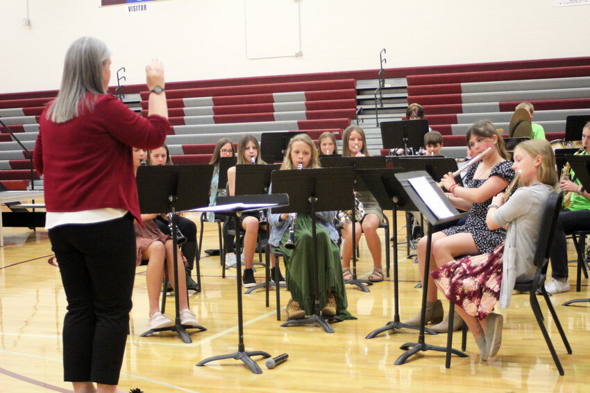 The Arlington Middle School band members performed &quot;Summit Fanfare&quot; to begin their spring program Tuesday evening.