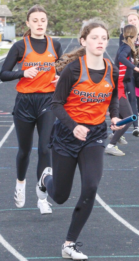 Amy Snader hands the baton to Briar Ray in the 4x100m relay.