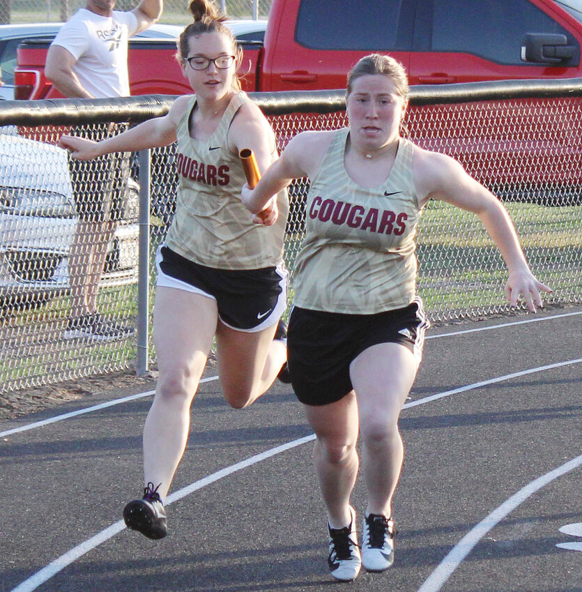 Alexia Schild and Sydney Olsen complete the 2nd exchange in the 4x100 relay which ran a season's best 55.80