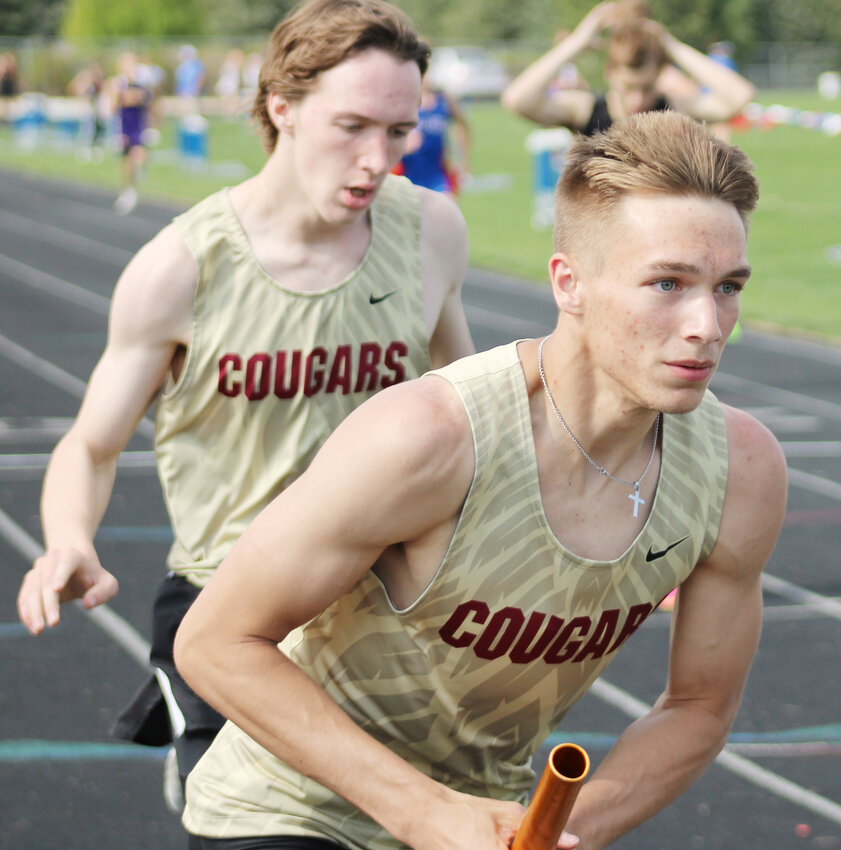 Colton Miller and Gavin Brownell compete in the 4x400 relay.
