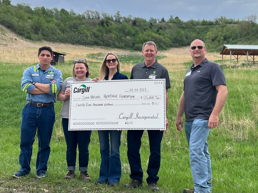 Three Cargill Cares Council representatives presented a $25,000 check to the Iowa Natural Heritage Foundation for Little Sioux Scout Ranch Preservation Project. Pictured from right, Alex Esperanza, Abby Hade Terpstra, Maggie Smith, Joe McGovern and Aaron Matson.