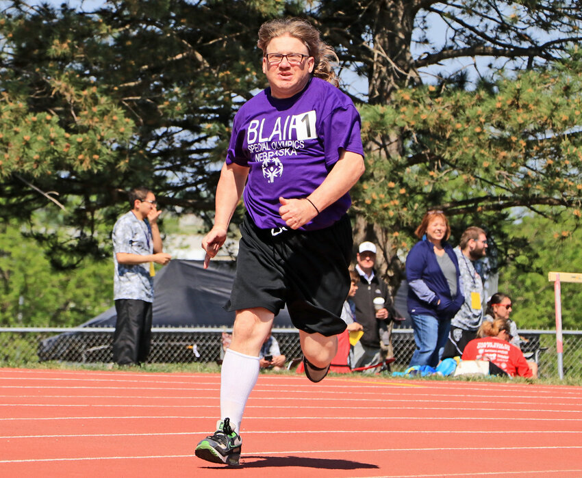 Blair Special Olympics' Nathan Tanderup runs the 200-meter dash Saturday during the Nebraska Summer Games at Omaha Northwest High School.