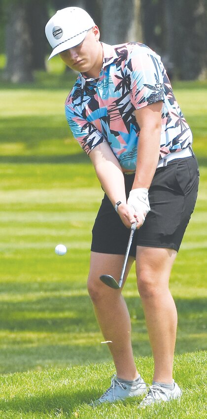 Owen Anderson chips onto the green in the 2023 Boys Class C Nebraska State Golf Tournament at Elks Country Club in Columbus.