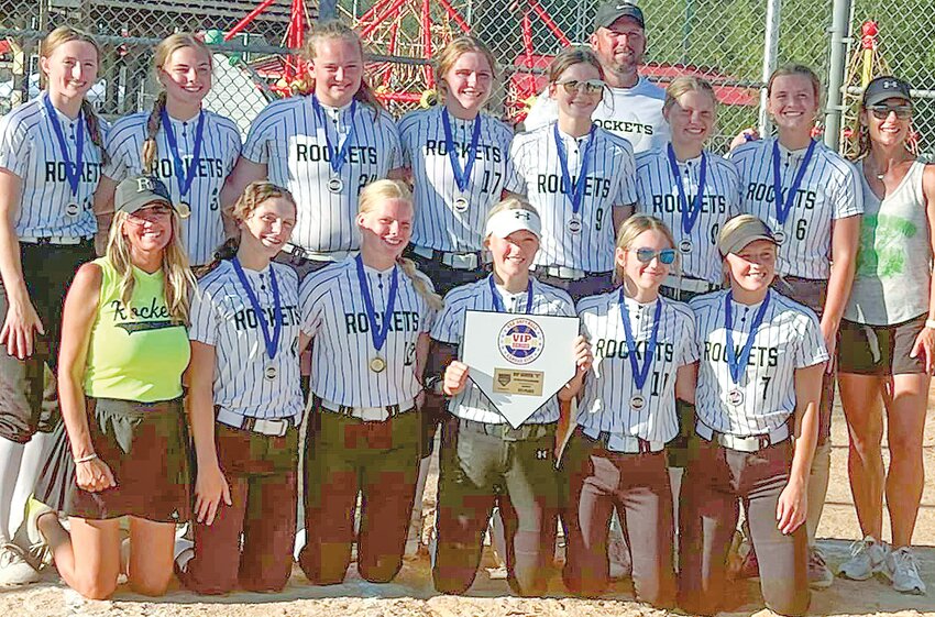 Bringing home the VIP Championship from a Kansas City Tournement are the 18u Oakland-Craig Rockets.  Team members include: (back from left) Bailey Pelan, Anisten Rennerfeldt, Emma Johansen, Morgan Ray,Hilary Ray, Coach Andy Rennerfeldt, Bailey Denton, Shea Johnson, and Coack Nikki Ray; (front from left) Coach Angie Rennerfeldt Briar Ray, Adi Rennerfeldt, Kara Selken, Haylee Puffer, and Laryn Johnson.
