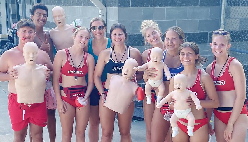 Proudly displaying their new CPR Family Pack awarded through a safety grant through LARM are Oakland lifeguards (from left) Jesse Droescher, Avery Bryan, Kara Selken, Makenna Pearson, Mya Guzinski, Grace Petersen, Taryn Harney, and Charli Webster.