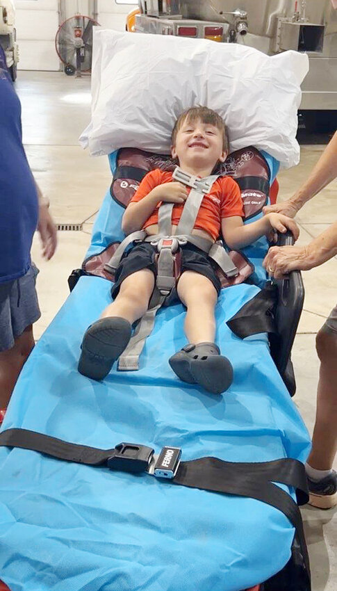 Knox Vavra, son of Brantley and Megan Vavra, was the perfect guinea pig for the Lyons Fire &amp; Rescue training with their new piece of equipment called the Pedi-Mate.