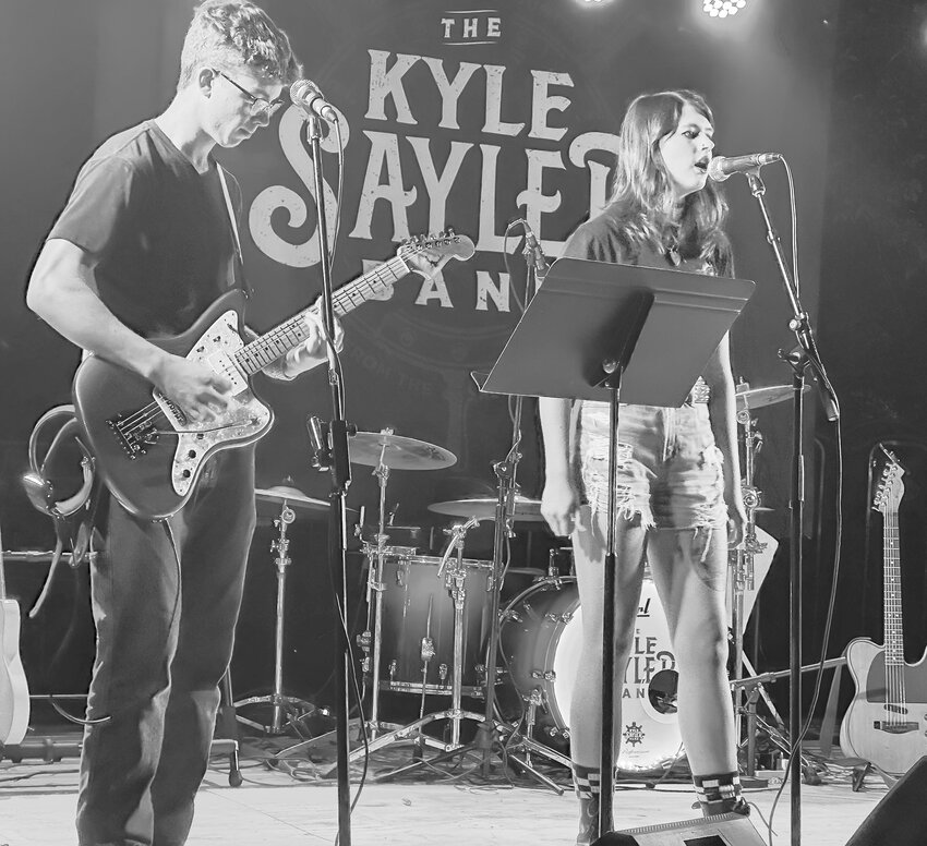 Owen Hineline and Mia Linder share a Greta Van Fleet song as headliner Kyle Sayler Band take a break before the second half of their show on Friday.
