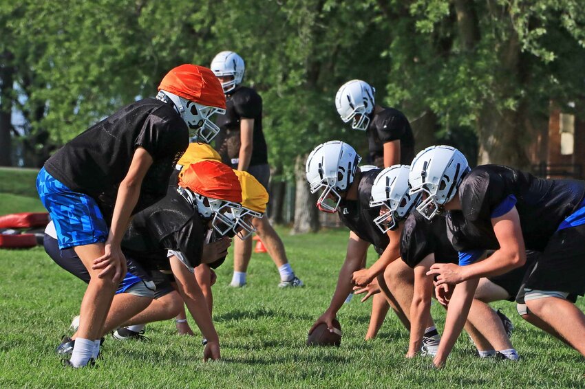 The Arlington Eagles line up against one-another during an Aug. 9 practice at AHS.