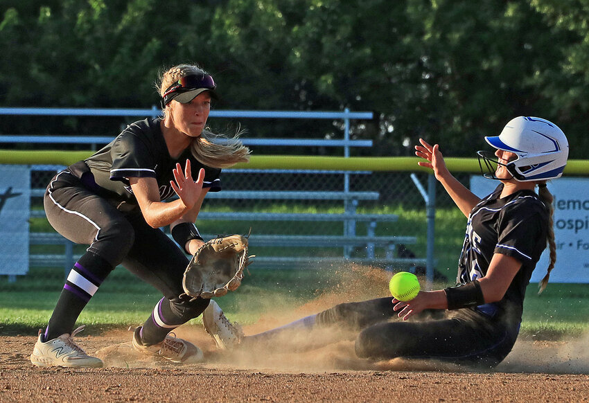 The Bears' Nessa McMillen, left, gets in position to catch a throw to second base as a Wayne Blue Devil slides in Thursday at the Blair Youth Sports Complex.