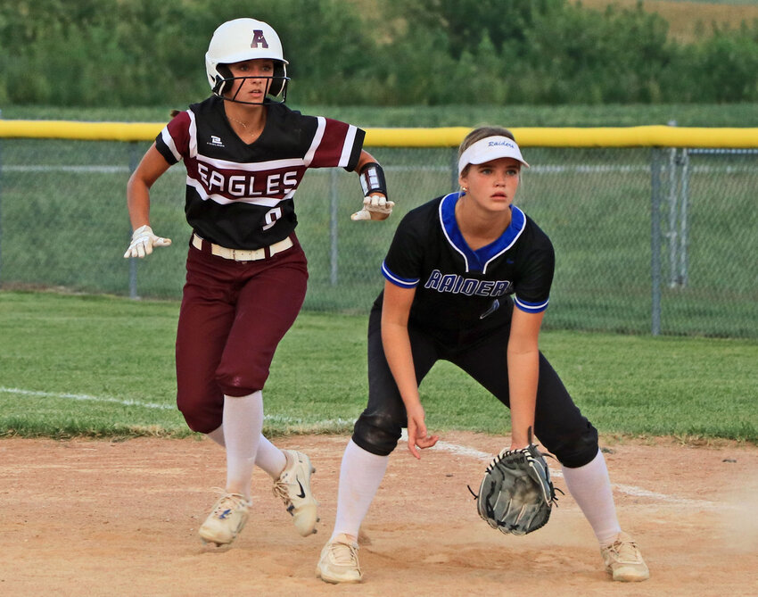 Arlington sophomore Savannah Lang, left, leads off of first base Monday against Logan View/Scribner-Snyder at the RVR Bank Sports Complex.