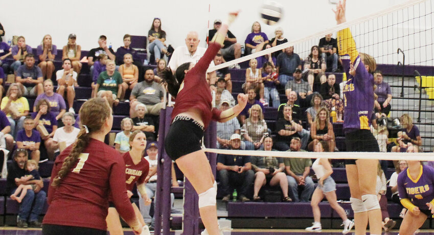Bailey Tuttle powers one of her kills through a Tiger block attempt.