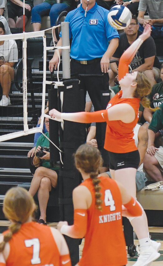 Karely Eriksen attempts a spike over the right side against Howells-Dodge.