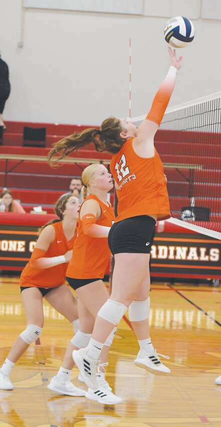 Briar Ray, Adi Rennerfeldt watch as Morgan sends one over the net against Columbus Lakeview.