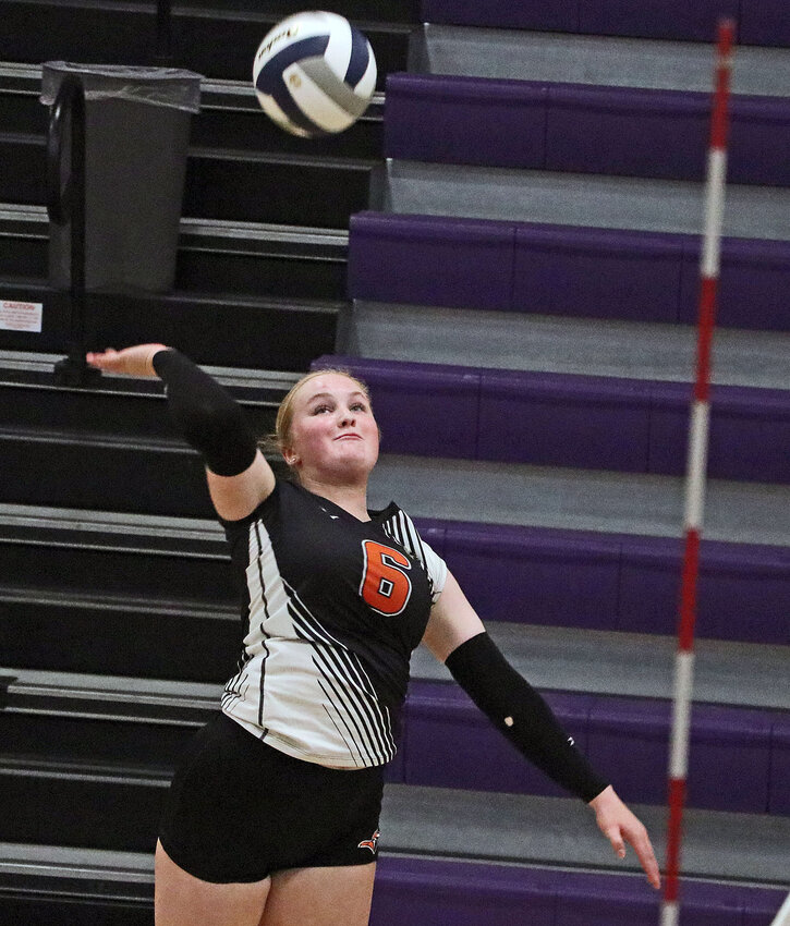 Fort Calhoun senior Raegen Wells rises up to spike the ball Saturday at Tekamah-Herman High School.