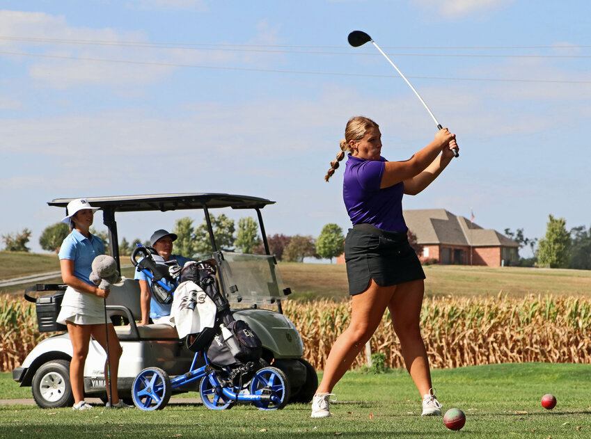 Blair's Wrylee Osterhaus, right, tees off on hole No. 2 on Thursday at River Wilds Golf Club.