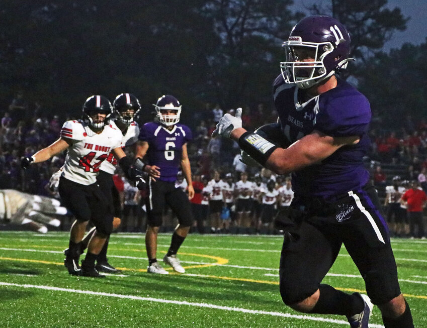 Blair senior Brady Brown, right, scores his second touchdown against Elkhorn Mount Michael on Friday at Krantz Field. The Bears won, 42-7.