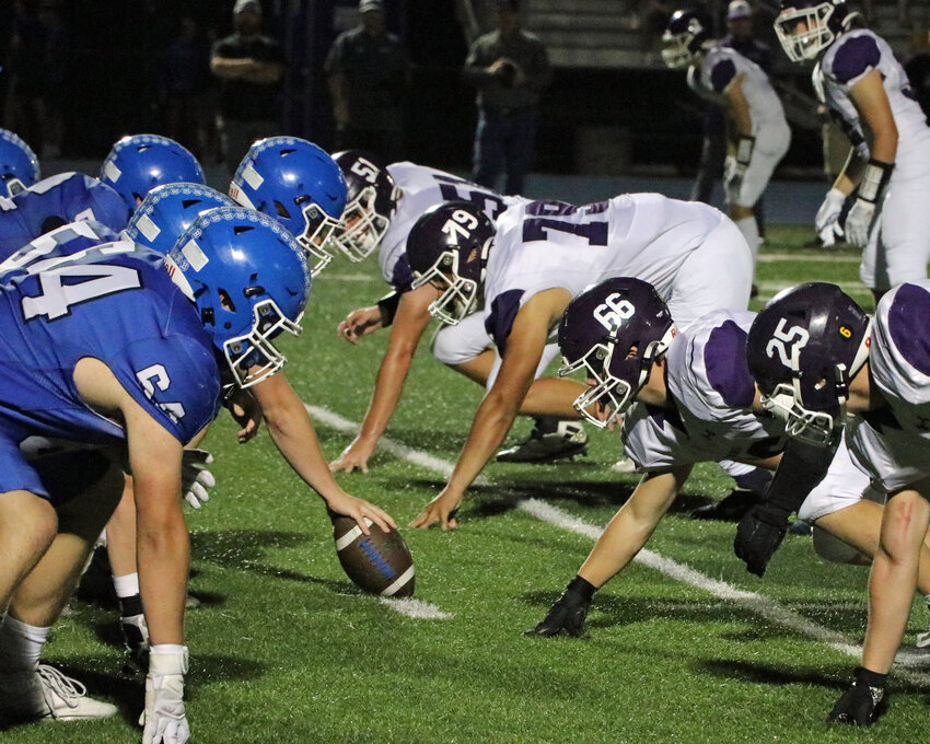 The Blair Bears' defensive line, right, sets up across from the Badgers on Friday at Bennington High School. Pictured are Thomas Chikos (51), Cornez Tucker (79), Brock Hamm (66) and Blaise Baughman (25).
