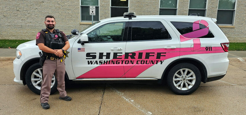 Washington County Jesse Carey wears a pink patch and various pink embelishments on his uniform, and also drives a pink Sheriff's Office vehicle during the month of October in support of Breast Cancer Awareness month.