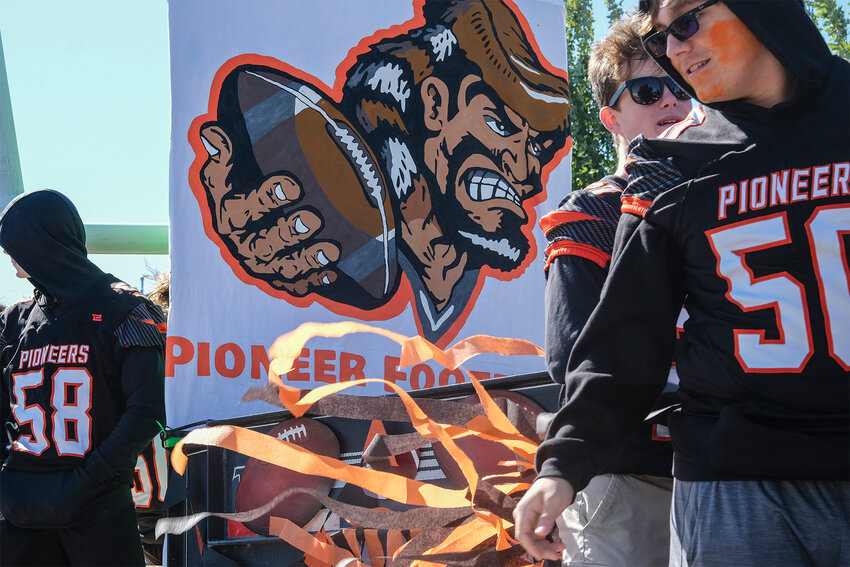 Fort Calhoun High School football players ride on a float in the homecoming parade.