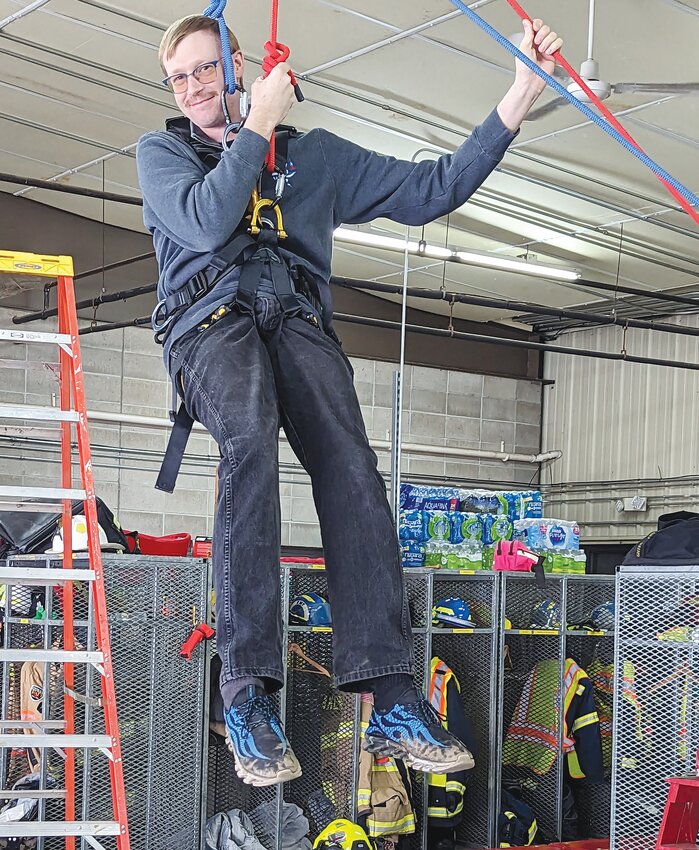 Training with the rope rescue gear, Jerry Redding-Geu prepares for this uniquely challenging scenario.