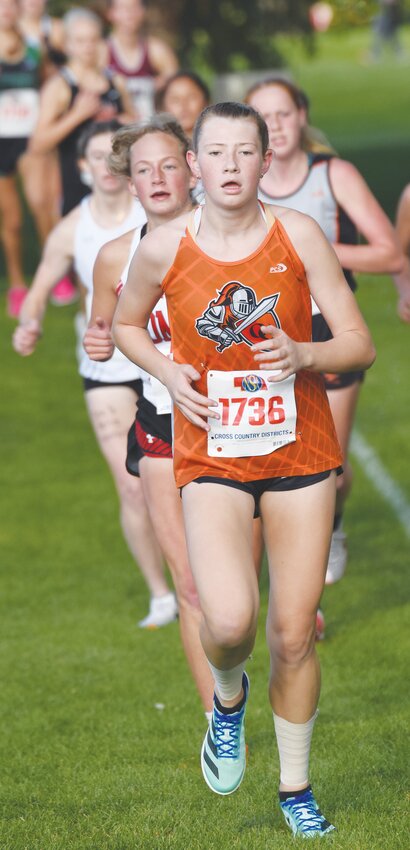 Punching her ticket to State, Carolyn Magnusson finished 10th at Districts with a time of 21:29.