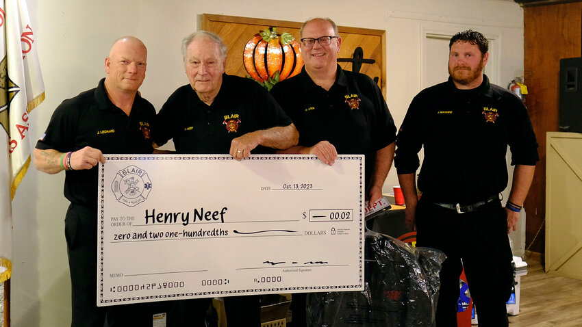 Henry Neef, second from left, was honored for 50 years of service at the Blair Volunteer Fire Department banquet Saturday at the Blair Marina. Pictured with Neef, from left, is Chief Joe Leonard, First Assistant Chief Dave Aten and Second Assistant Chief Joe Maguire.