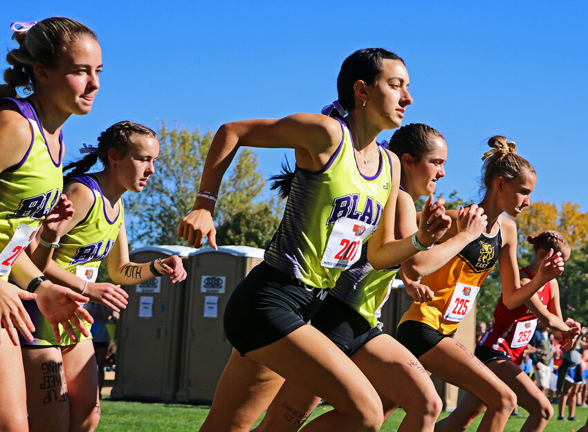 Blair runners Allie Czapla, from left, Ryen Anderson, Reece Ewoldt and Nadia Davey race from the starting line Friday during the Class B State Cross-Country Championships at Kearney Country Club.