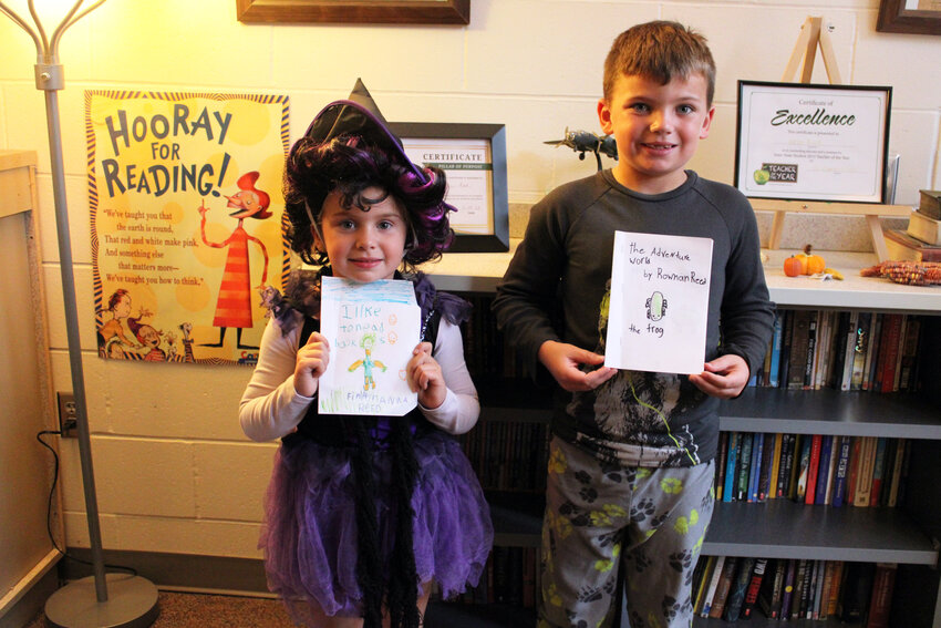 Finlan and Rownan Reed published and displayed their stories on the Arlington Public Library's new Local Young Authors' Original Works shelf. The siblings said they enjoy writing and drawing pictures for their books.