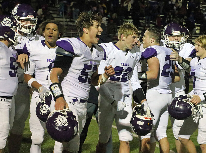 Braden McGill (53) and the Blair Bears celebrate a 21-14 first round Class B playoff win Friday at Plattsmouth High School.