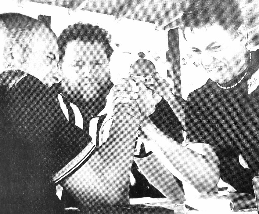 Cory Miller of Cheyenne, Wyo., and John Grant of Stewartville, Minn., arm wrestle in 2004 during a championship tournament in Washington County.