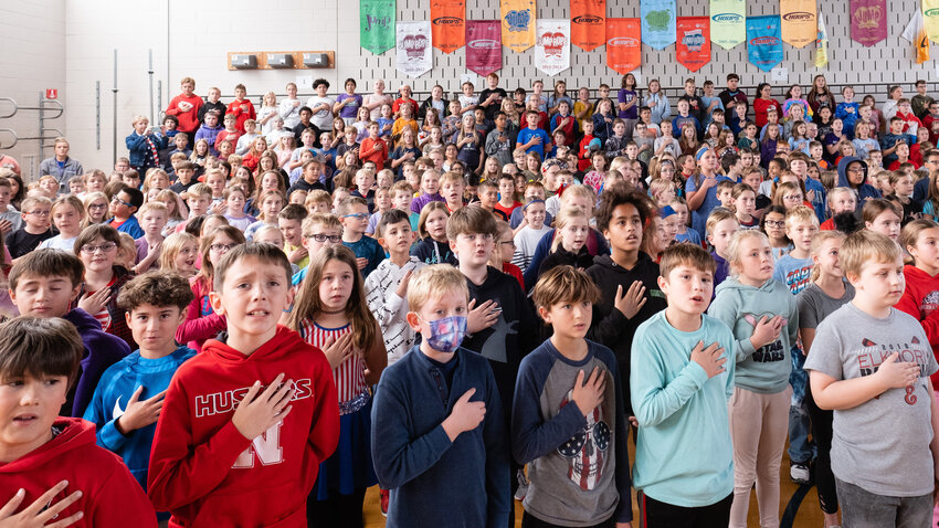 Arbor Park students recite the Pledge of Allegiance during the opening of A Salute to Veterans on Nov. 11.
