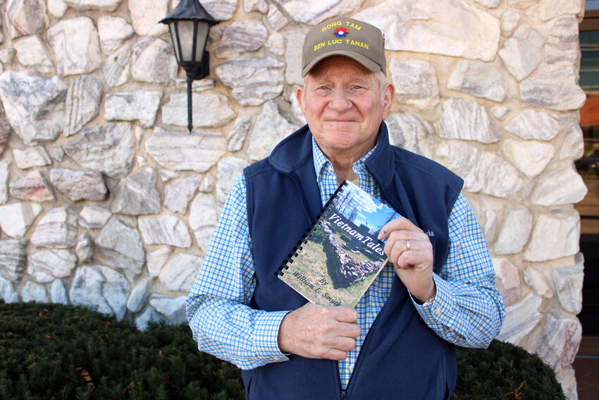Bill Smutko pictured with his anthology, &quot;Vietnam Tales.&quot; Inside are several short stories Smutko has written, based on his and others' experience during the Vietnam War.
