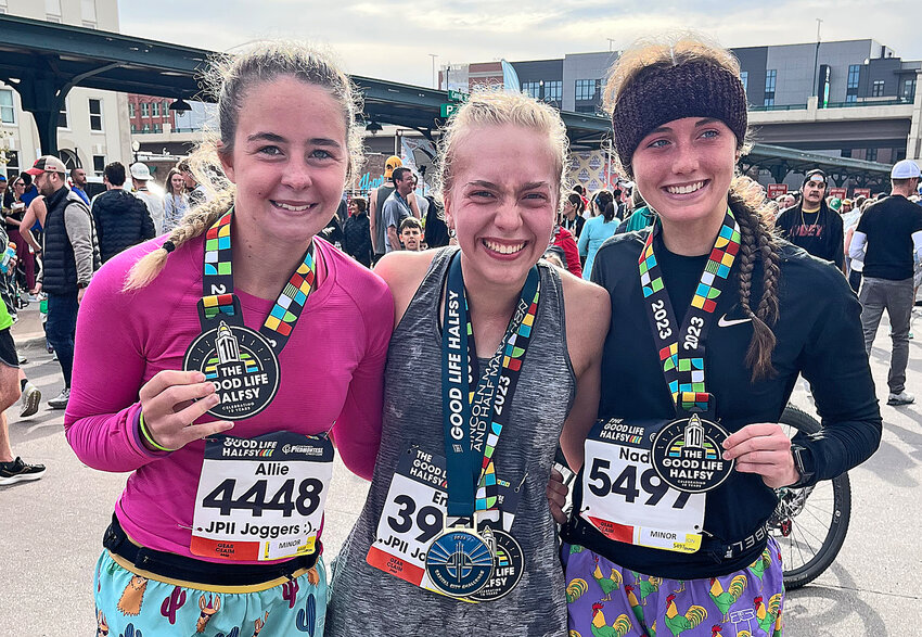 Allie Czapla, from left, Emily Lamoureux and Nadia Davey of Blair pose for a photo after running The Good Life Halfsy half marathon in Lincoln on Nov. 5.